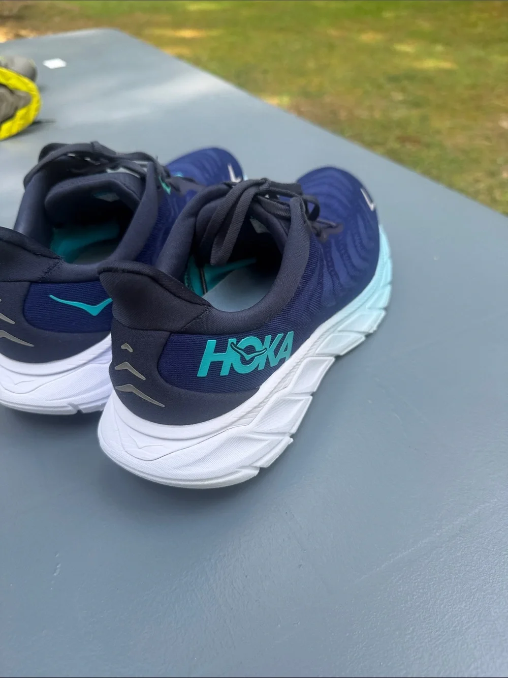 Hoka Navy Running Shoes with Aqua Accents. Wide shoes